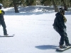 Adaptive Action Sports snowboard coach Chris Koeppe gives Gary Nolte a few pointers as they head down the run.