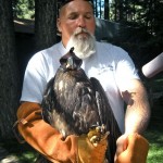 Wayne McKnight takes the eagle from Lake Tahoe WIldlife Care. Photo/Kathryn Reed