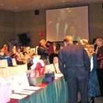 People scour the silent auction tables March 27. Photo/Kathryn Reed