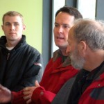 Contractor Joe Stewart, center, speaks with Josh Mercow and Harold Singer on Wednesday.