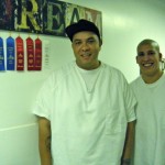 Inmates Carlos Gonzalez and Eric Malone show-off their ribbons from the county fair.