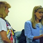 Patty Smith, left, listens to Mayor Kathay Lovell.