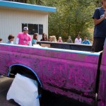 Principal Ryan Galles, pink shirt, watches his truck become bright pink. Photos/Kathryn Reed