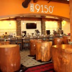 The 9,150 Bar at the Tamarack Lodge has tables made from trees cut at the resort. Photo/Provided