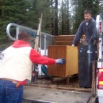 Jeff Pollitt and Lou Graves of Clean Tahoe on March 14 load up furniture. Photo/Tracy Owen Chapman