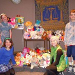 Ellie Krolicki, Trent Dingman, Caroline Krolicki and Alexandra Palant with the toys the collected for CASA. Photo/Kathryn Reed