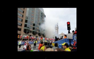 Smoke rises April 15 after bombs went off near the finish line of the Boston Marathon. Photos/Les Wright