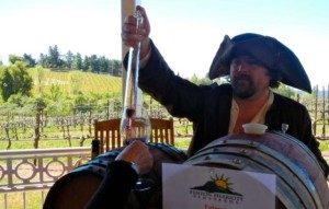 Guy Herriott of Fenton Herriott provides a sample of the 2010 Merlot. Photos/Kathryn Reed