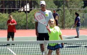 Rob Wheatley works on a volley drill with a youngster. Photo/Provided