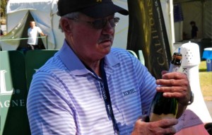 Korbel Champagne owner Gary Heck watched a lot of bubbly get sprayed July 17 at the media cork popping contest. Photo/Kathryn Reed