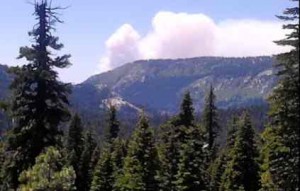 Smoke rises from a wildfire in Kyburz on July 8. Photo/Ty Robben