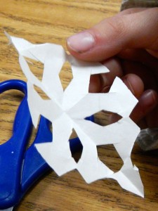 Student Mia Koda shows off her snowflake.