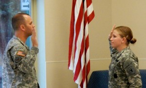 Staff Sgt. Bethany Brown is administered the Army oath Nov. 13 by Capt. David Robinson. Photo/LTN