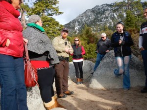 Ranger Allen Woolridge, center, talks about the history of Sand Harbor.