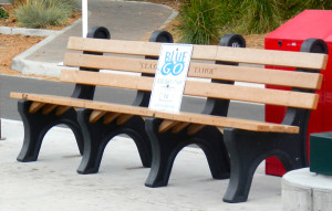 Bus riders are supposed to know this bench with a BlueGo sign is a stop.