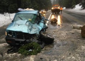 The driver survived a boulder crashing into his vehicle on Highway 50. Photo/Caltrans