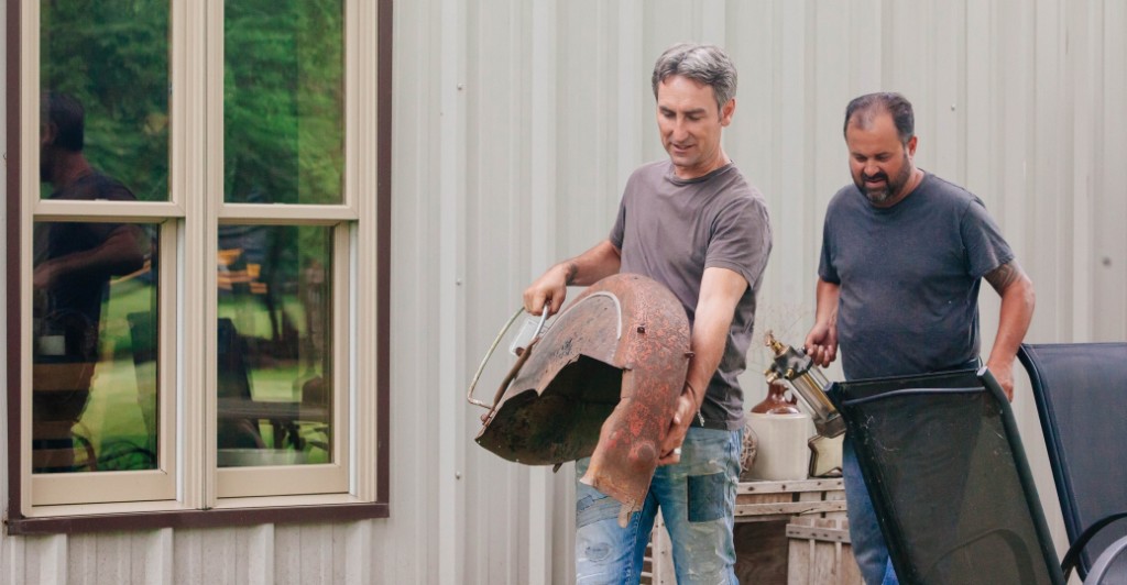 Mike Wolfe and Frank Fritz haul their find back to their vehicle. Photo/American Pickers