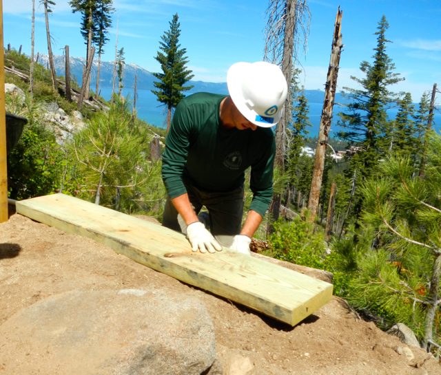 Chris Binder creates a landing area for the cement to be stored. Photo/Kathryn Reed