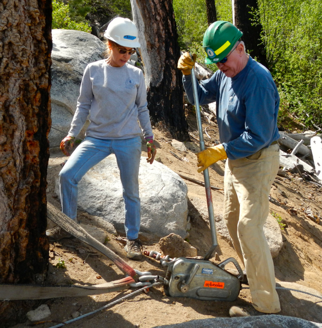 Bonnie Fair and John McKenna work the hoist. Photo/Kathryn Reed