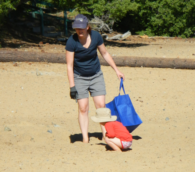 Alexa and Connor Burke are in search of trash at Kiva. Photo/Kathryn Reed