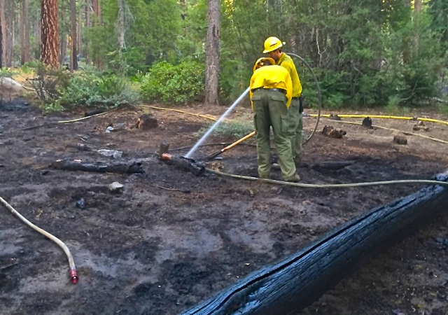 Crews extinguish a blaze near the state line on Aug. 30. Photo/USFS