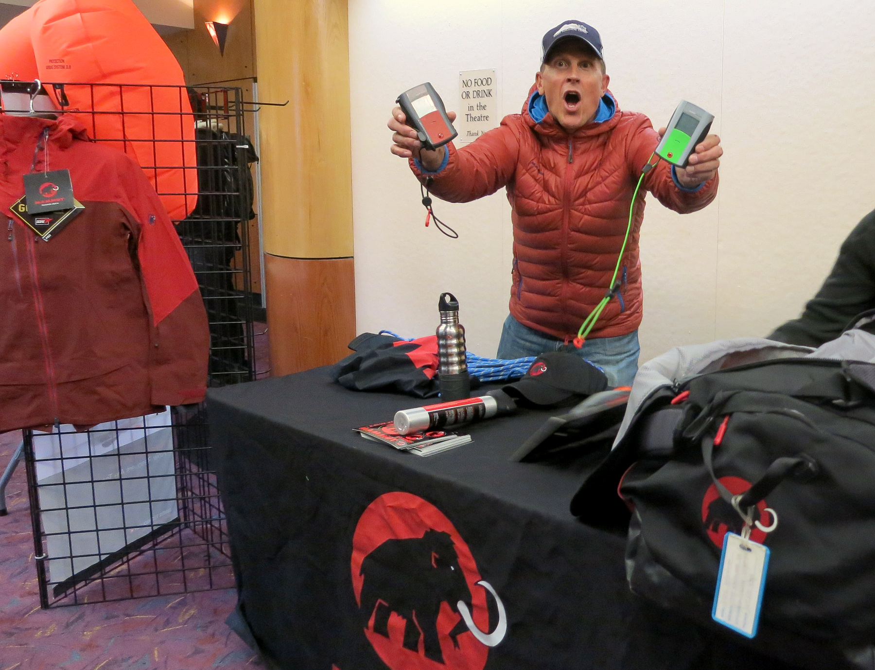 Sierra Avalanche President Todd Offenbacher shows off some avalanche beacons at the Mammut table. Photo/Jessie Marchesseau