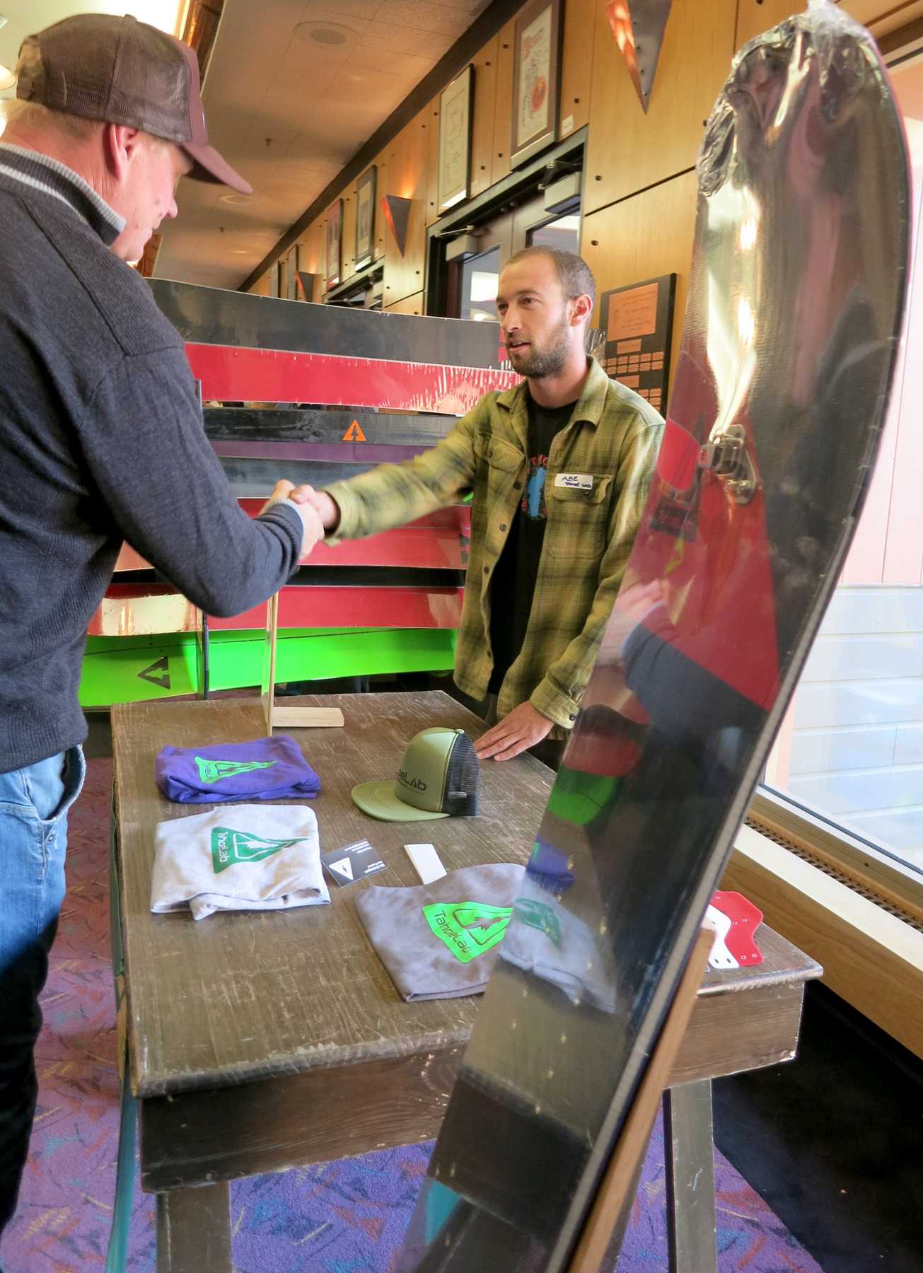 Abe Greenspan of TahoeLab talked gear with skiers and snowboarders at the California Avalanche Workshop. Photo/Jessie Marchesseau