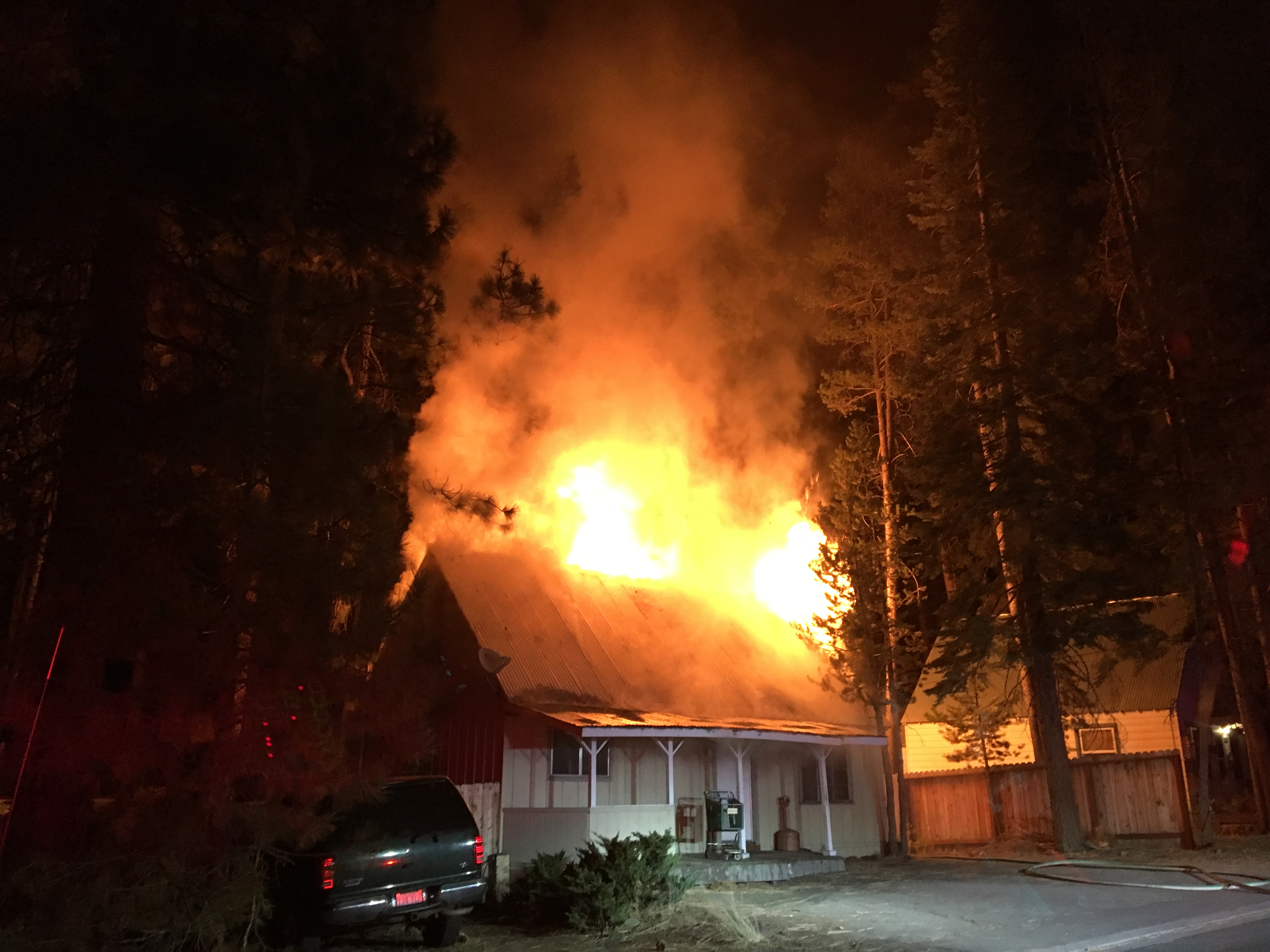 A house near the state line in South Lake Tahoe goes up in flames Oct. 2. Photo/SLTFD