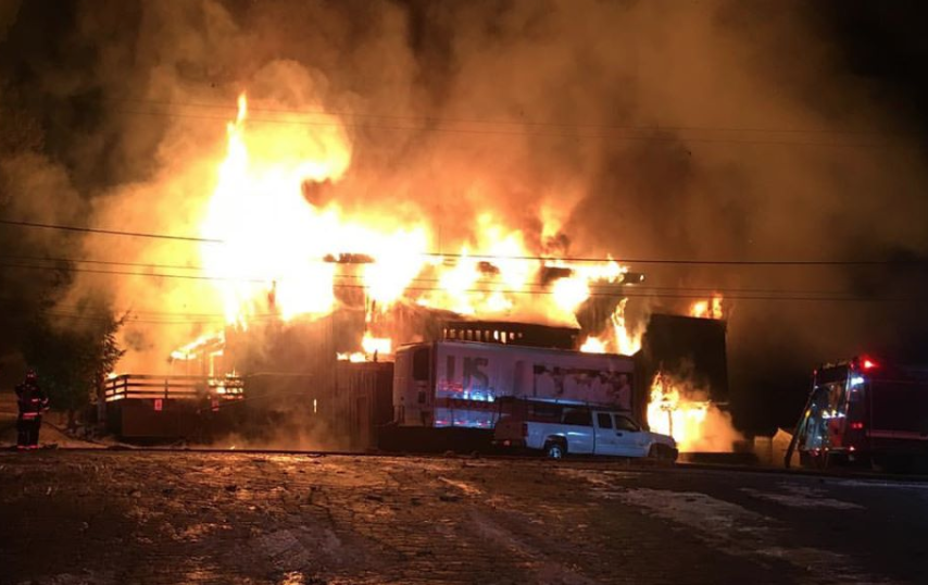 Crews work to suppress the fire at Homewood on Dec. 28. Photo/Provided