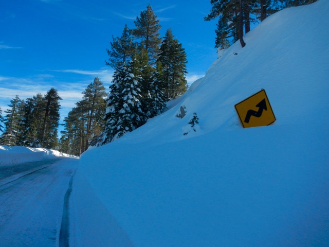 Most of the road signs near Emerald Bay are at least partially buried. Photo/Kathryn Reed
