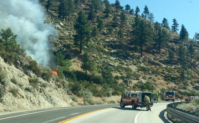 Vehicle fire in brush closes Kingsbury Grade